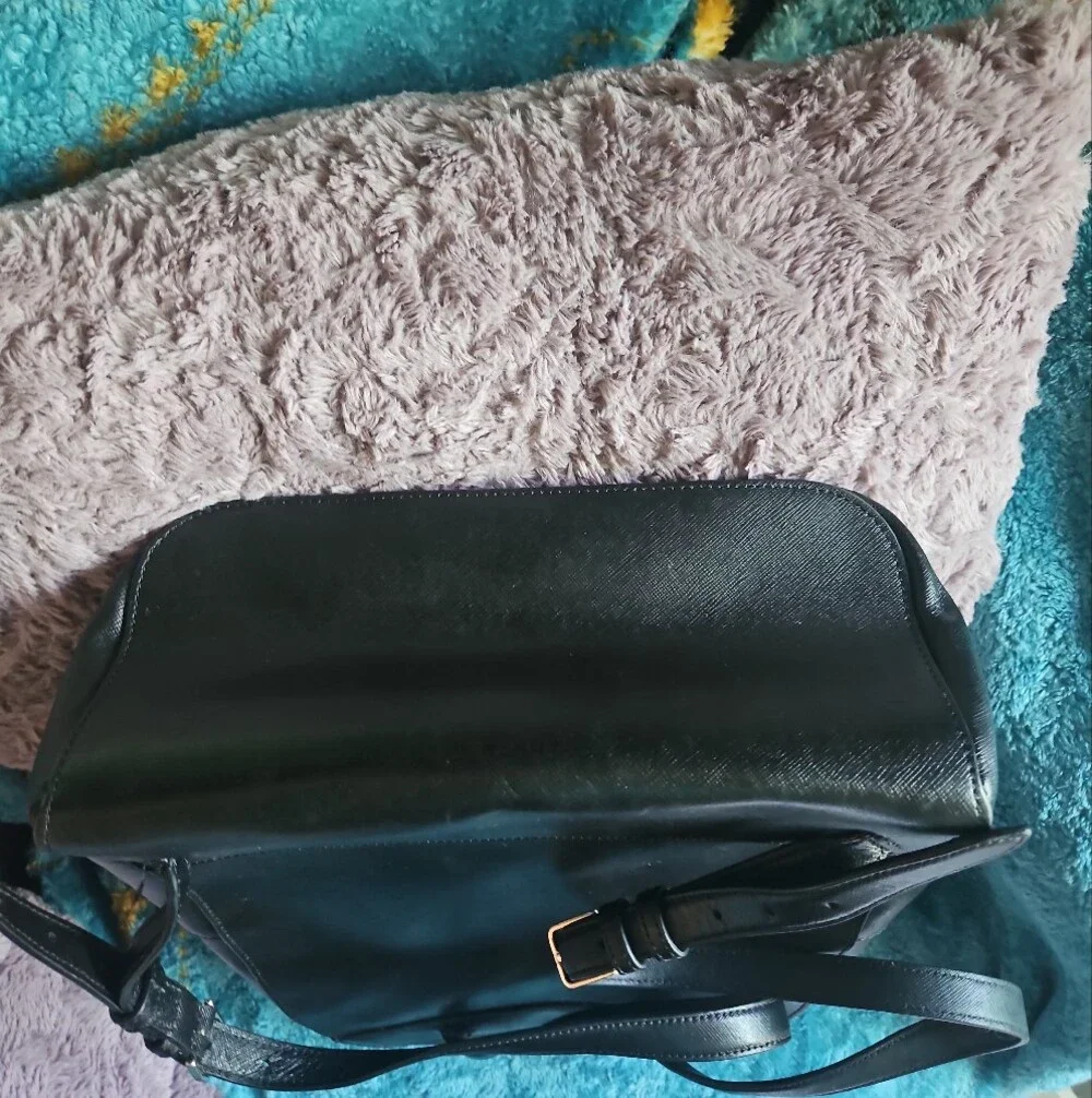 AS-IS Kate Spade black leather backpack LEFT STRAP AT THE TOP TORN. STILL NEW